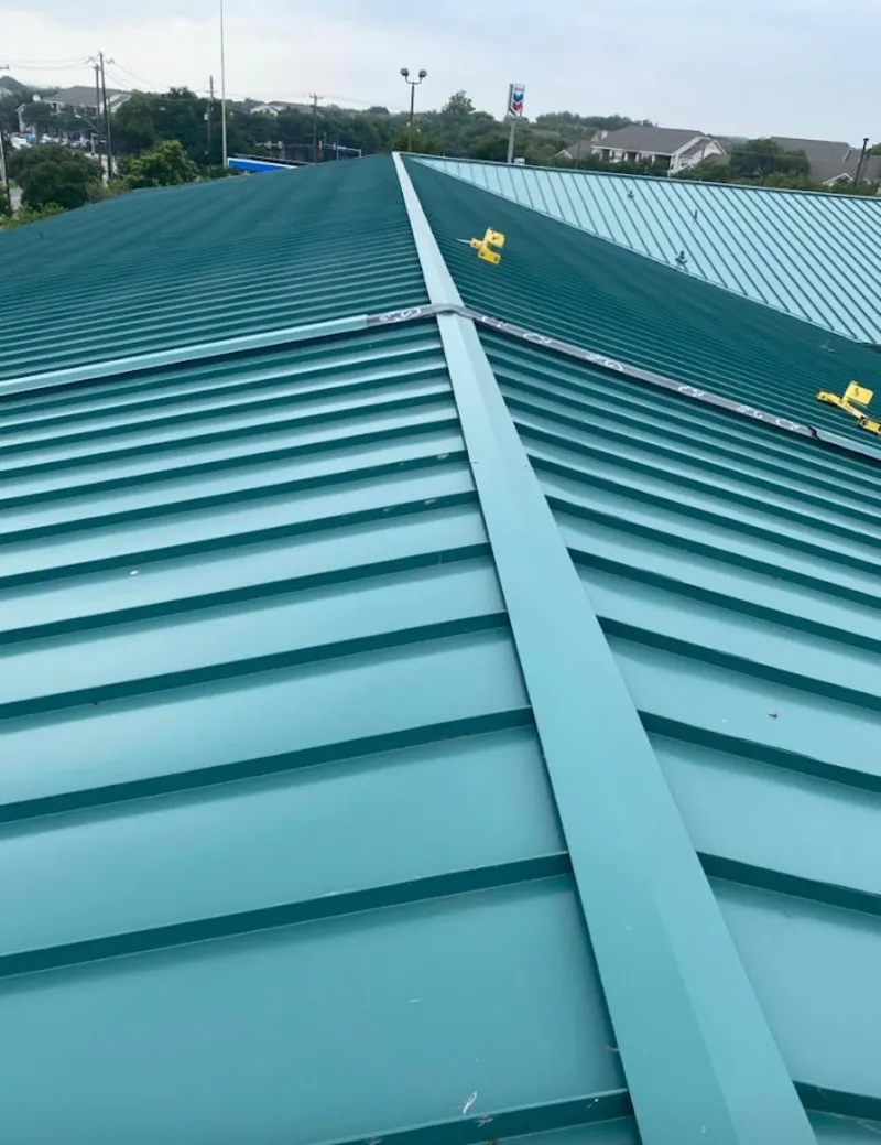 Green commercial metal roof ridge and valley for Metal Roof Repair in Lake Barrington
